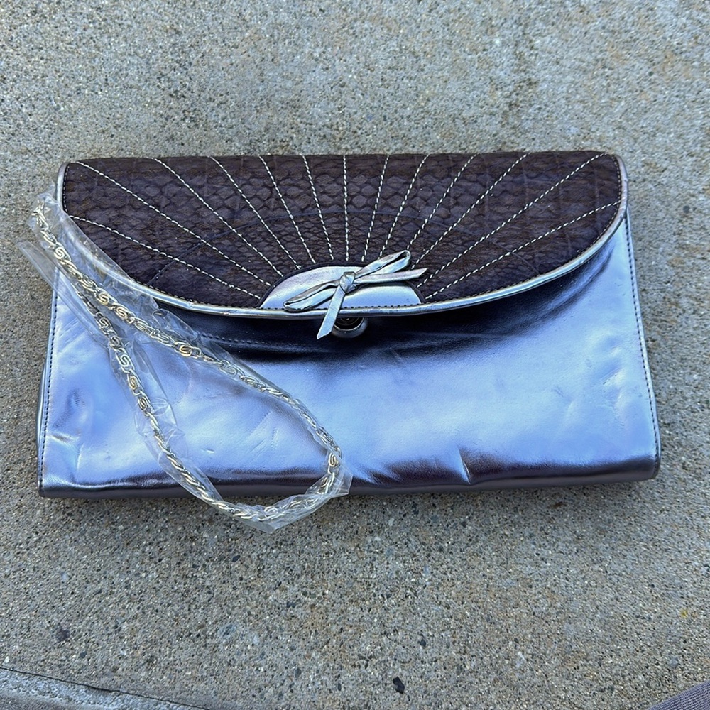 silver and faux snakeskin clutch purse with chain.   Never used.